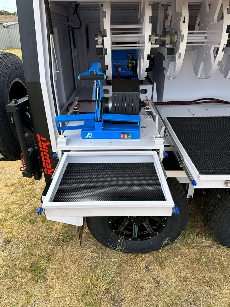 Hydraulic hose cut-off saw installed inside the RedDirt hydraulic repair trailer for trimming hoses to length